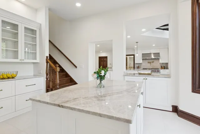 a spacious bedroom with a bed and a couch