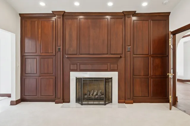 a bathroom with a toilet a sink a vanity and mirror