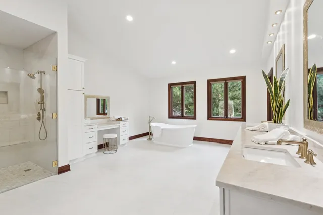 a front view of a house with a garden and plants