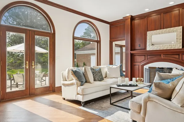 a wooden bench sitting in front of a window