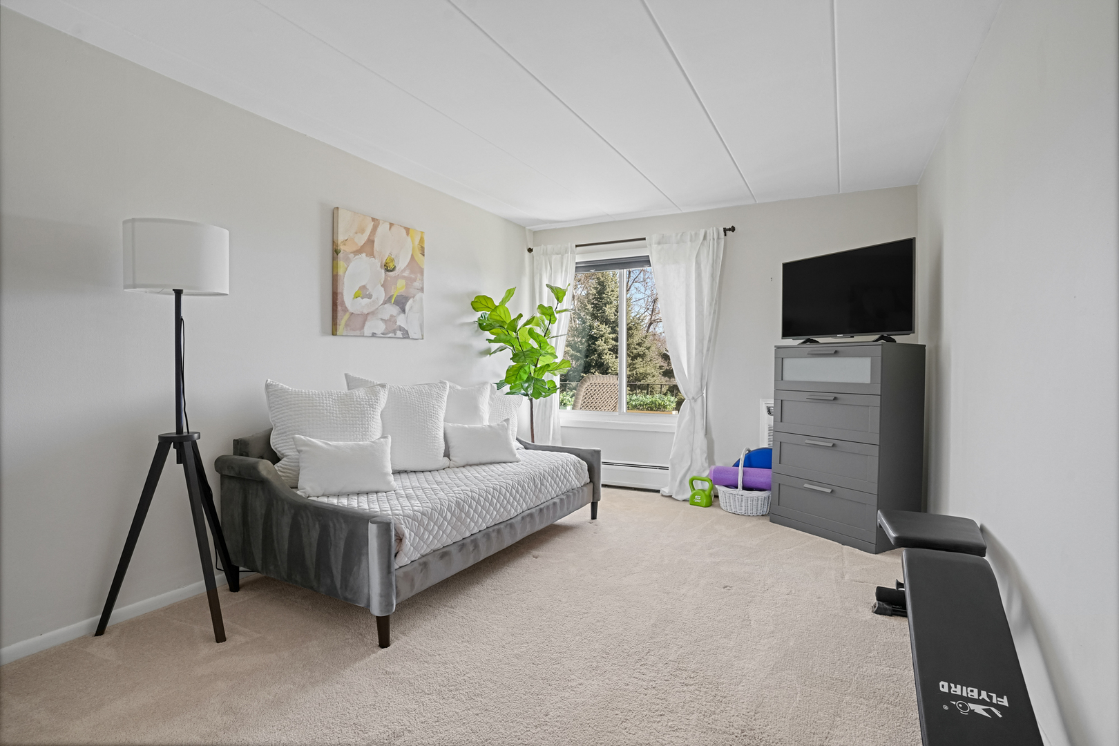 16 East Old Willow Road, Unit 223S Prospect Heights, IL 60070 - Photo 11 of 27 a living room with furniture and a flat screen tv