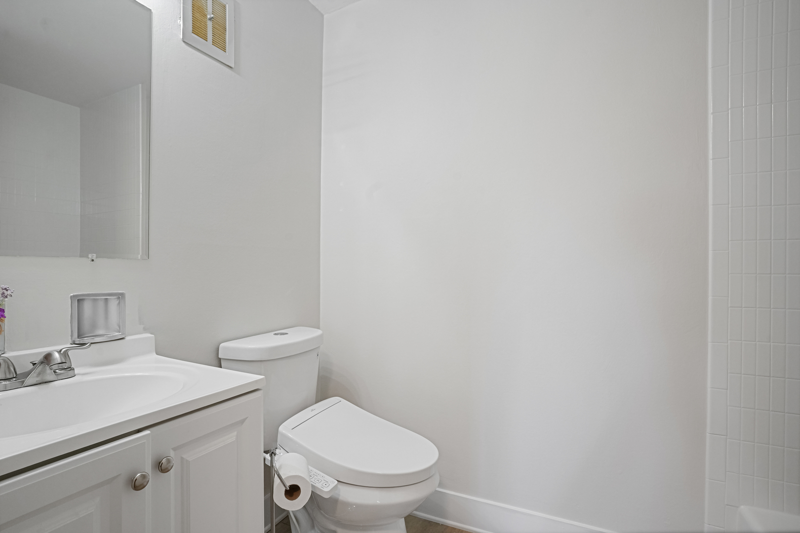 16 East Old Willow Road, Unit 223S Prospect Heights, IL 60070 - Photo 12 of 27 a bathroom with a sink a toilet and a mirror