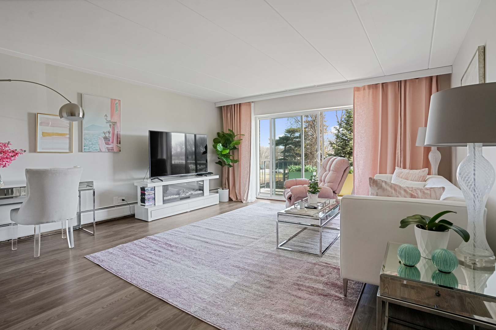 16 East Old Willow Road, Unit 223S Prospect Heights, IL 60070 - Photo 4 of 27 a living room with furniture and a flat screen tv