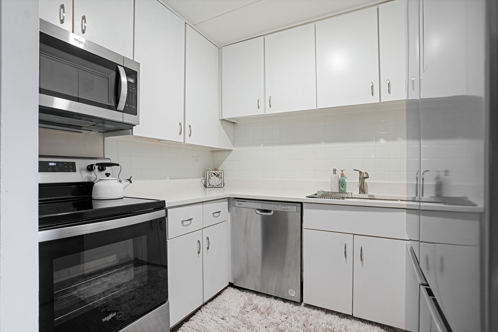 16 East Old Willow Road, Unit 223S Prospect Heights, IL 60070 - Photo 6 of 27 a kitchen with cabinets stainless steel appliances and sink