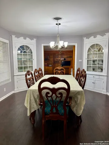 a bed room with furniture and a chandelier