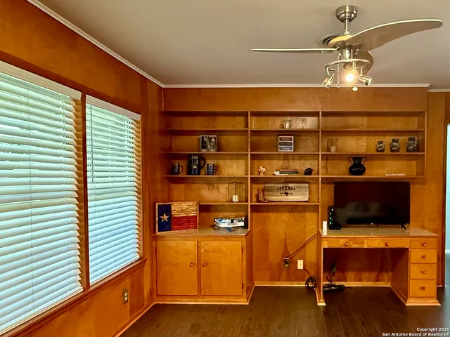 a room with furniture and a flat screen tv