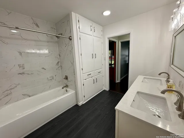 a bathroom with a sink and a bathtub