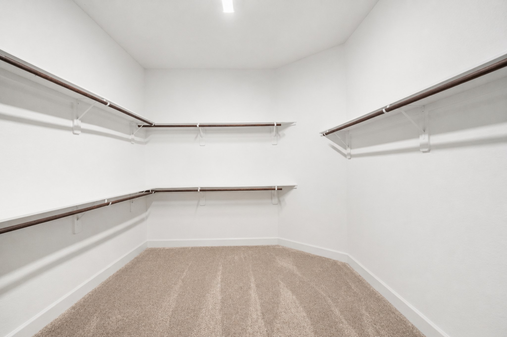 3118 Swift Way Katy, TX 77493 - Photo 22 of 34 Walk-In Closet – Expansive walk-in closet with ample hanging space and shelving, providing excellent organization options.