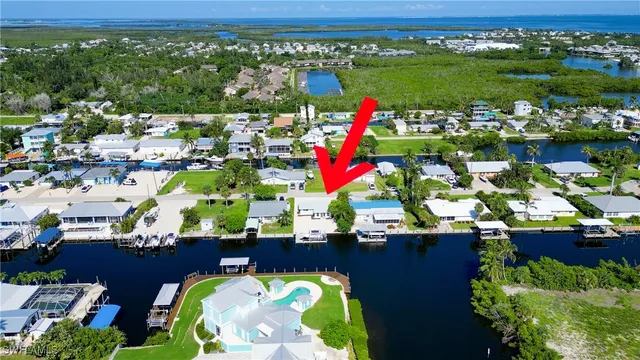 a view of swimming pool with a table and chairs