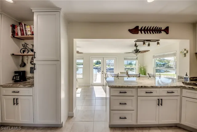 a kitchen with cabinets and window