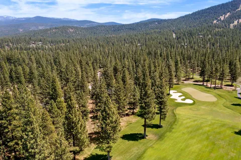a view of a city with mountains in the background