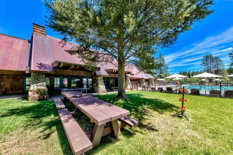a view of a house with a yard porch and sitting area