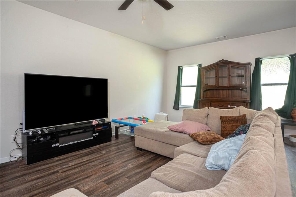 635 Meadows Farm Way Monroe, GA 30655 - Photo 9 of 36 a living room with furniture and a flat screen tv