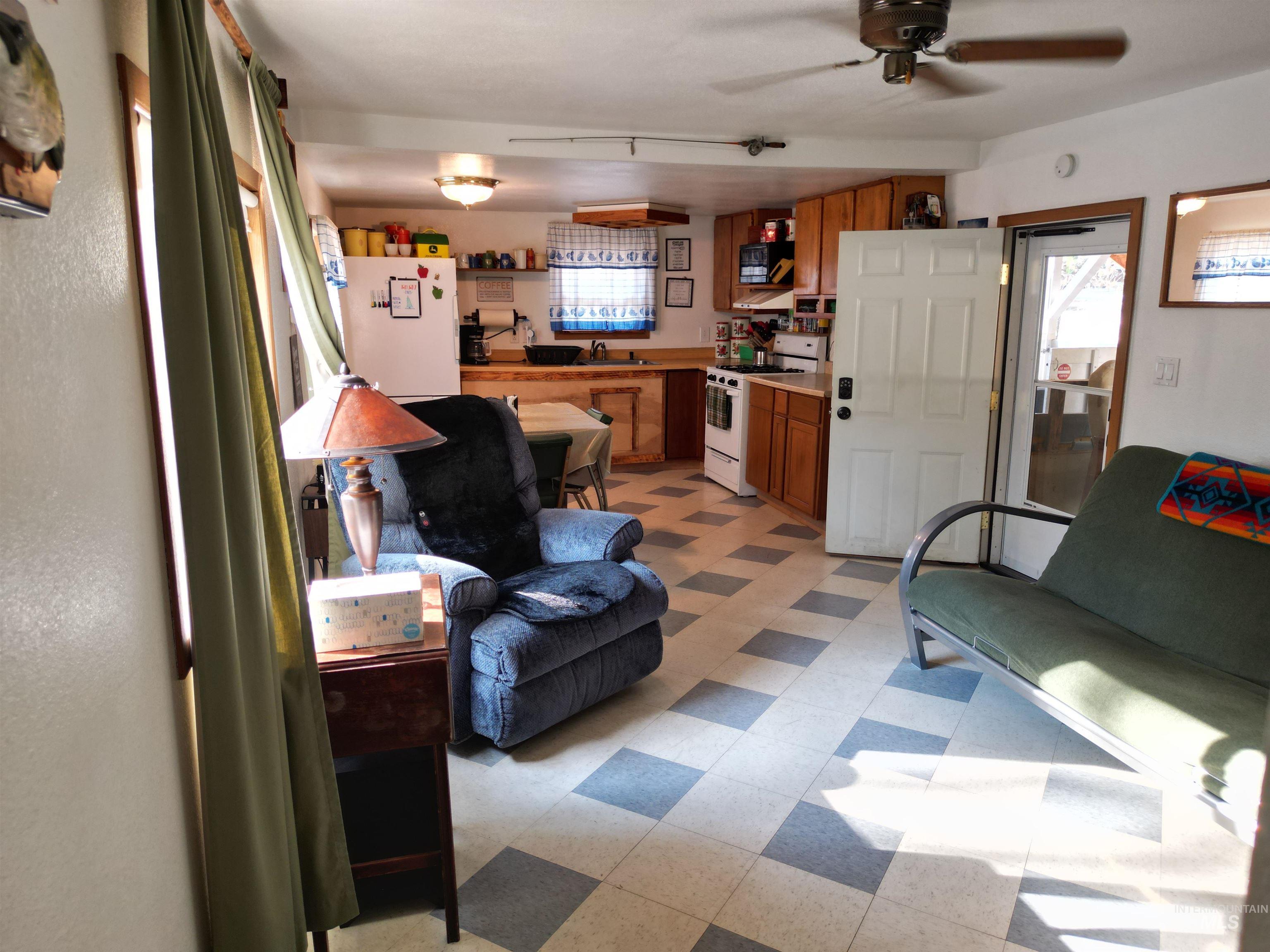 8395 Highway 21 Lowman, ID 83637 - Photo 10 of 22 Living room with light flooring and ceiling fan