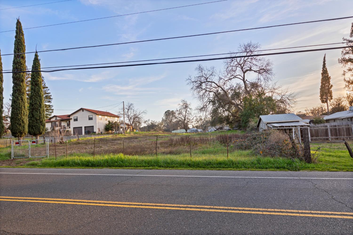 0 Webb Street Loomis, CA 95650 - Photo 6 of 13 a front view of a house with a yard and garage