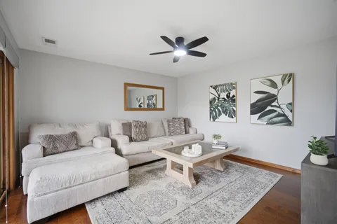 a living room with furniture and a rug