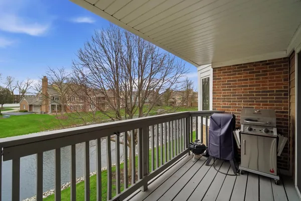 a view of a balcony with wooden floor