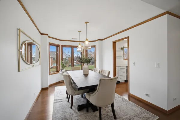 a view of a dining room with furniture window and outside view
