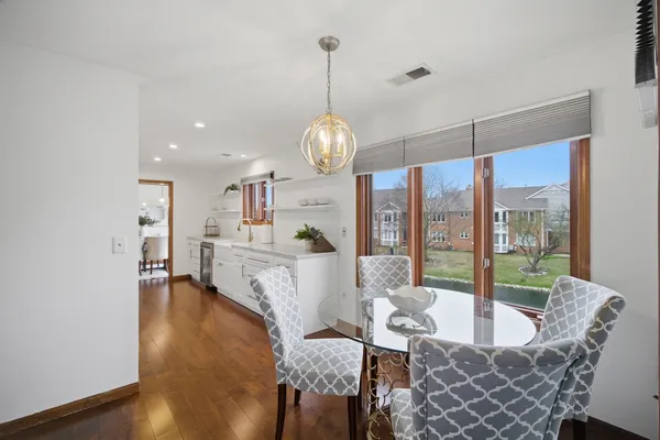 a living room with fireplace furniture and a wooden floor