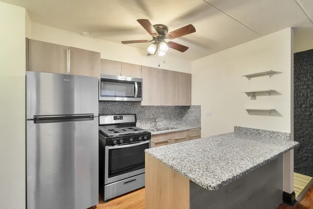 a kitchen with a refrigerator and a sink