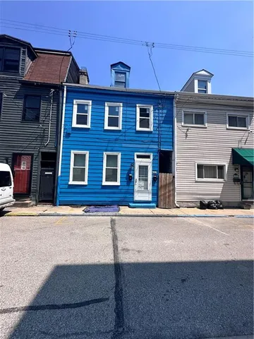 front view of a building with a street