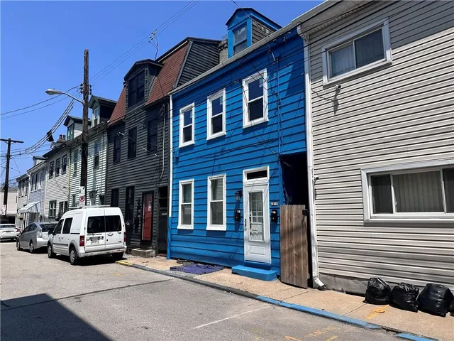 a car parked in front of a house