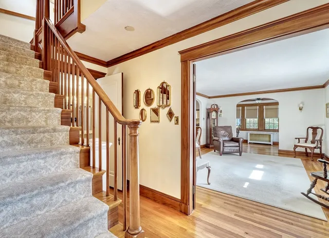 a view of a livingroom with furniture and stairs