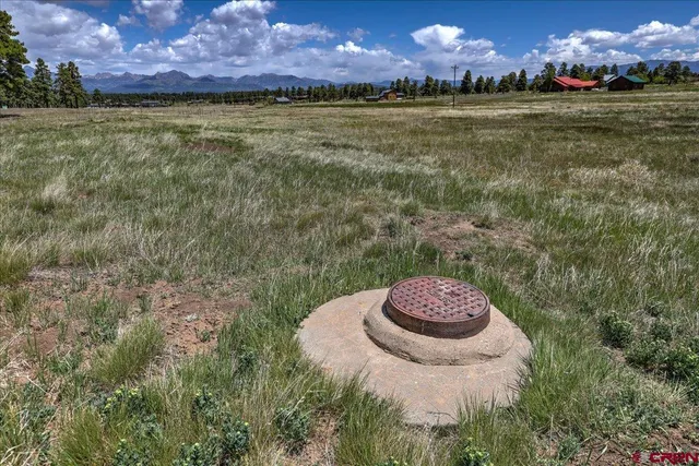 a view of a golf course with a lake