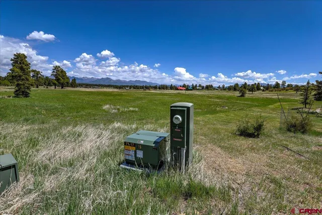 a view of a lake with a house in the background