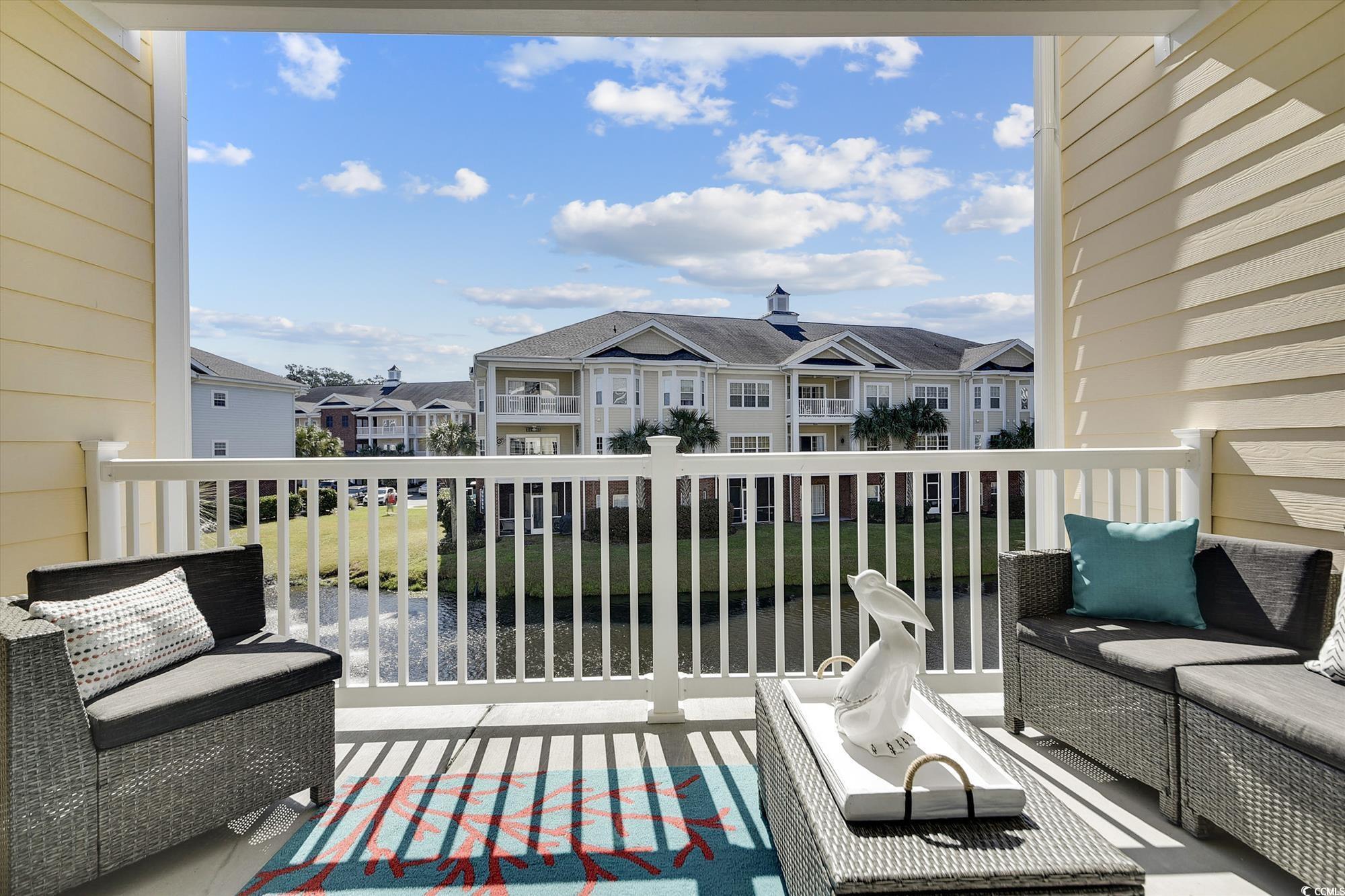 1029 Ray Costin Way, Unit VILLA 906 Murrells Inlet, SC 29576 - Photo 14 of 40 Balcony featuring a residential view