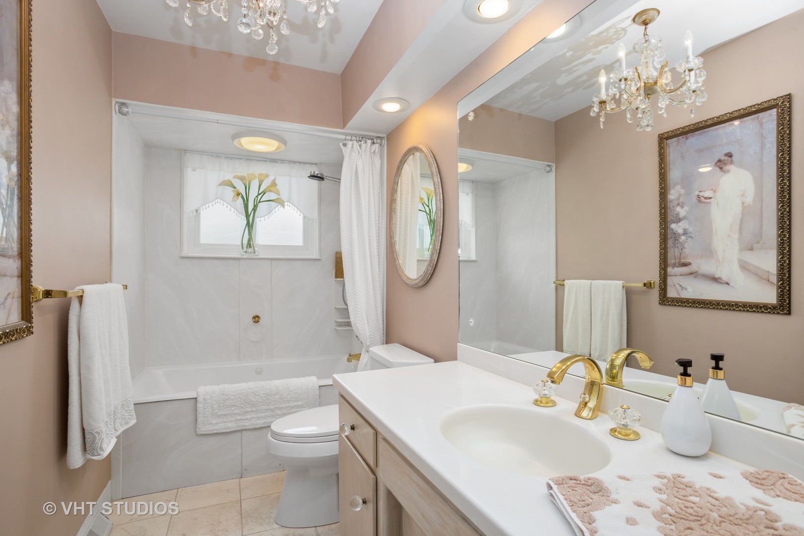 2227 South Wolf Road Des Plaines, IL 60018 - Photo 11 of 24 a bathroom with a toilet a sink and a mirror