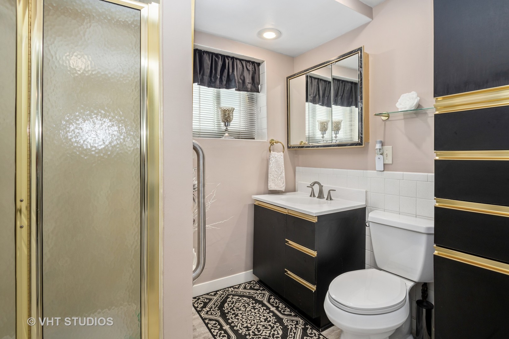 2227 South Wolf Road Des Plaines, IL 60018 - Photo 12 of 24 a bathroom with a sink a toilet and shower