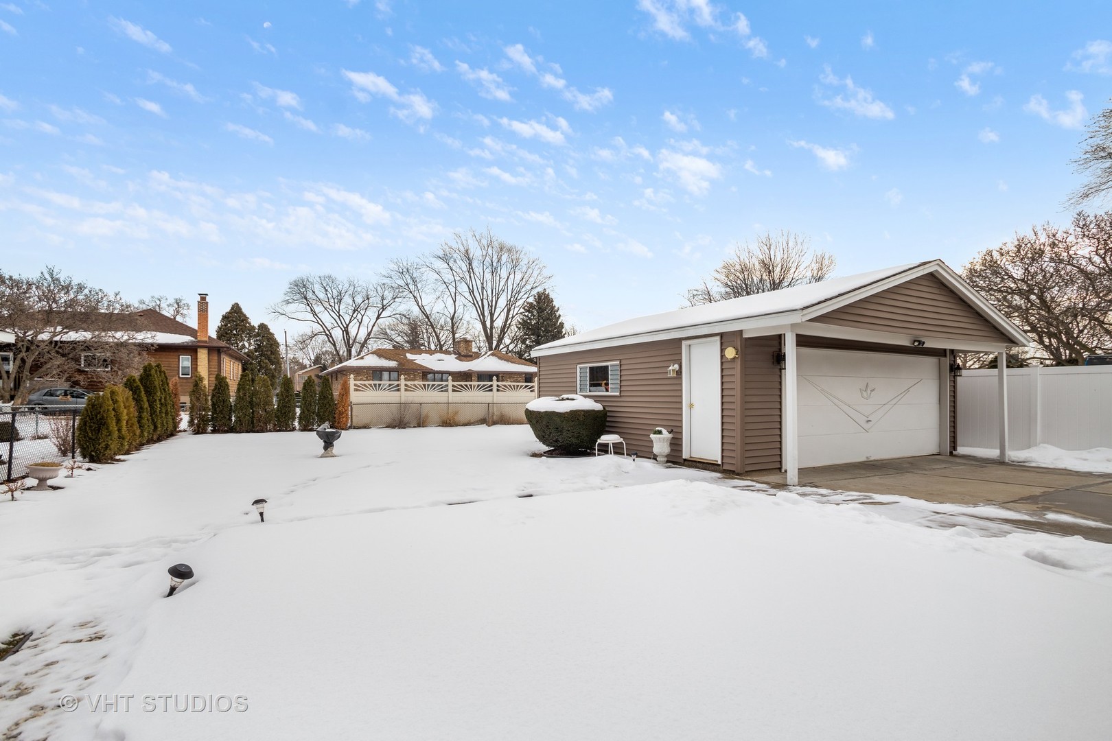 2227 South Wolf Road Des Plaines, IL 60018 - Photo 17 of 24 a view of a house with a snow in the background