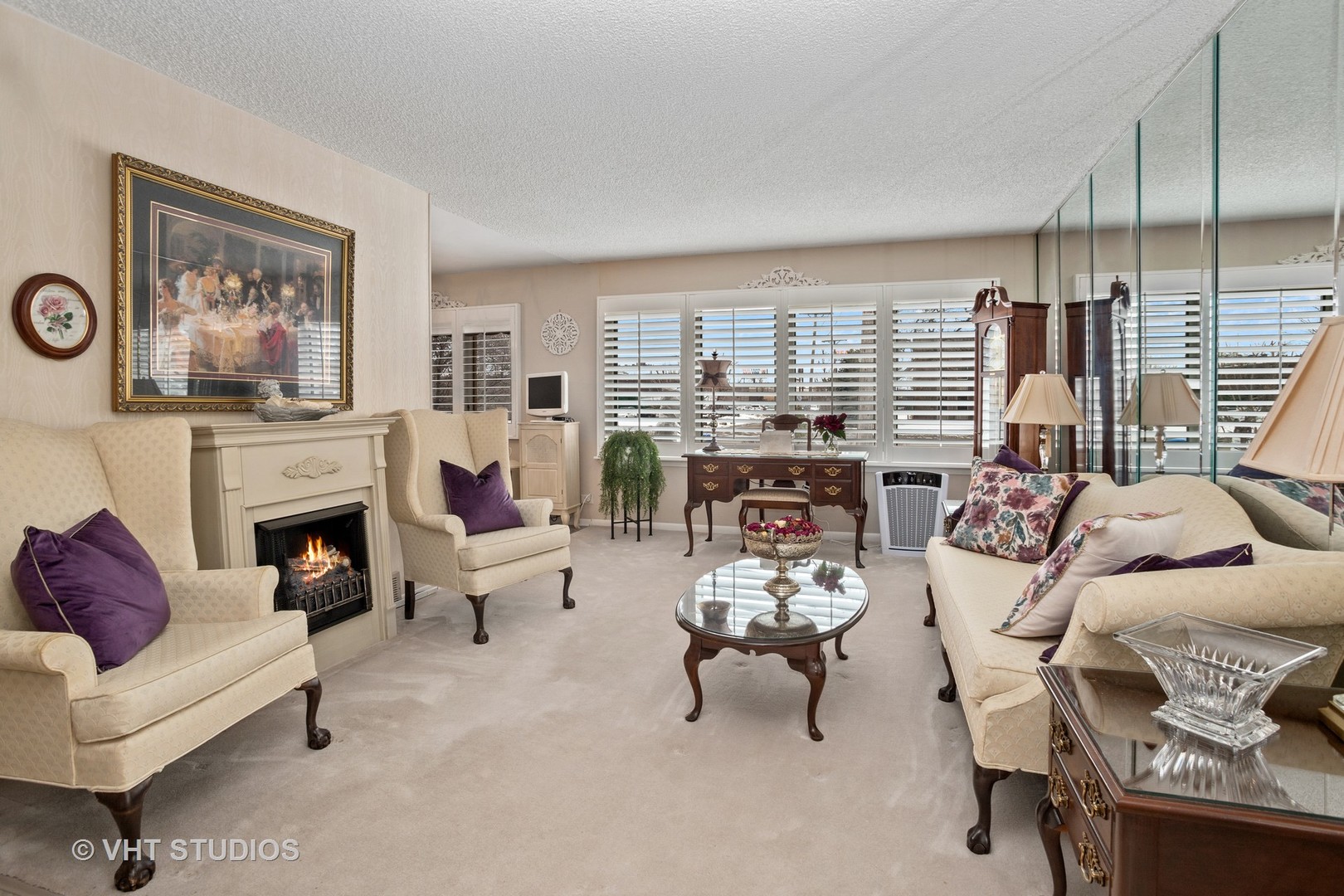 2227 South Wolf Road Des Plaines, IL 60018 - Photo 2 of 24 a living room with furniture fireplace and a large window
