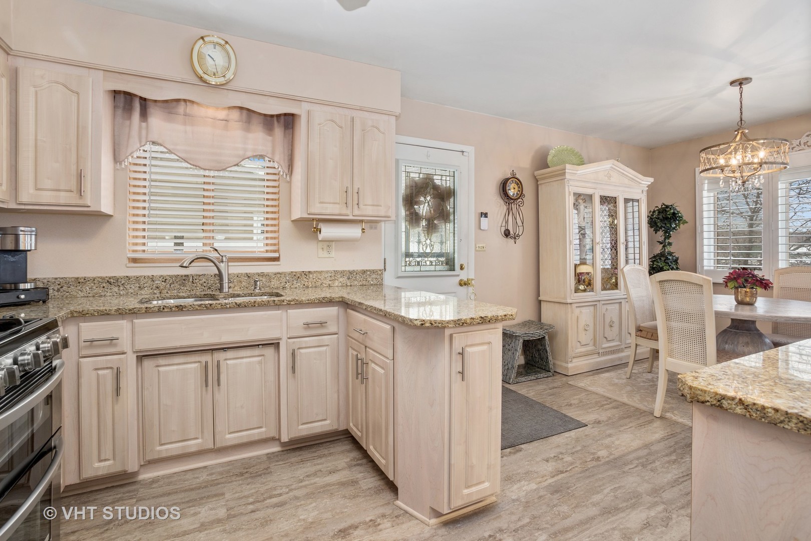 2227 South Wolf Road Des Plaines, IL 60018 - Photo 22 of 24 a large kitchen with granite countertop a sink and a stove