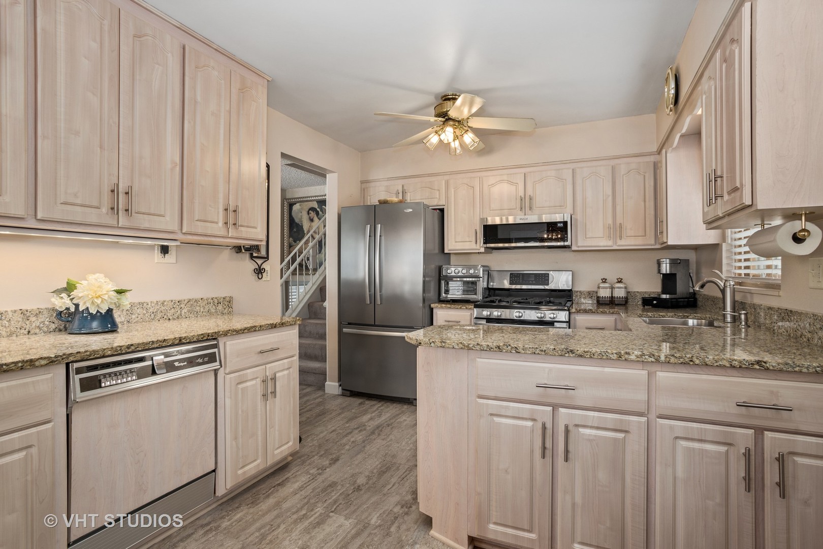 2227 South Wolf Road Des Plaines, IL 60018 - Photo 4 of 24 a kitchen with stainless steel appliances granite countertop a refrigerator a stove a sink and dishwasher