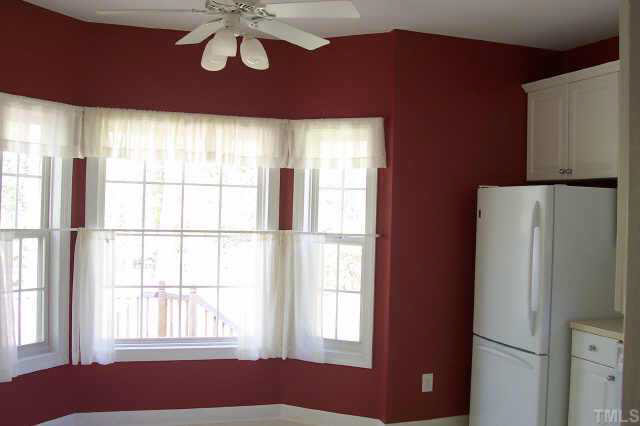 3806 Whispering Branch Road Raleigh, NC 27613 - Photo 4 of 9 a view of an empty room with a window