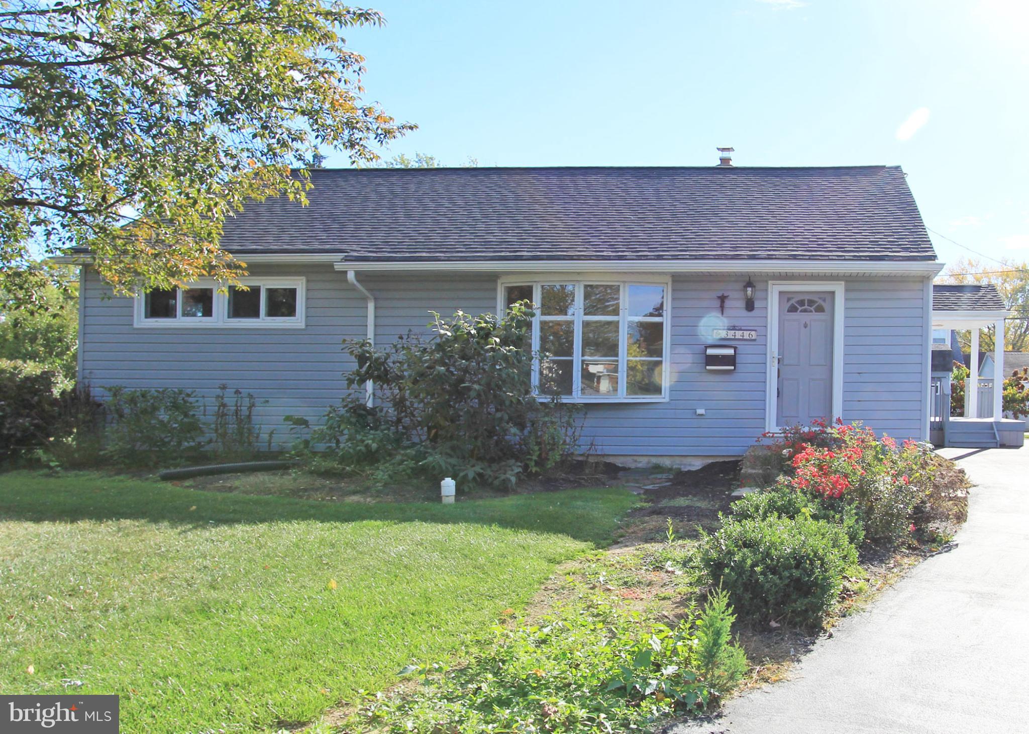 front view of a house with a yard