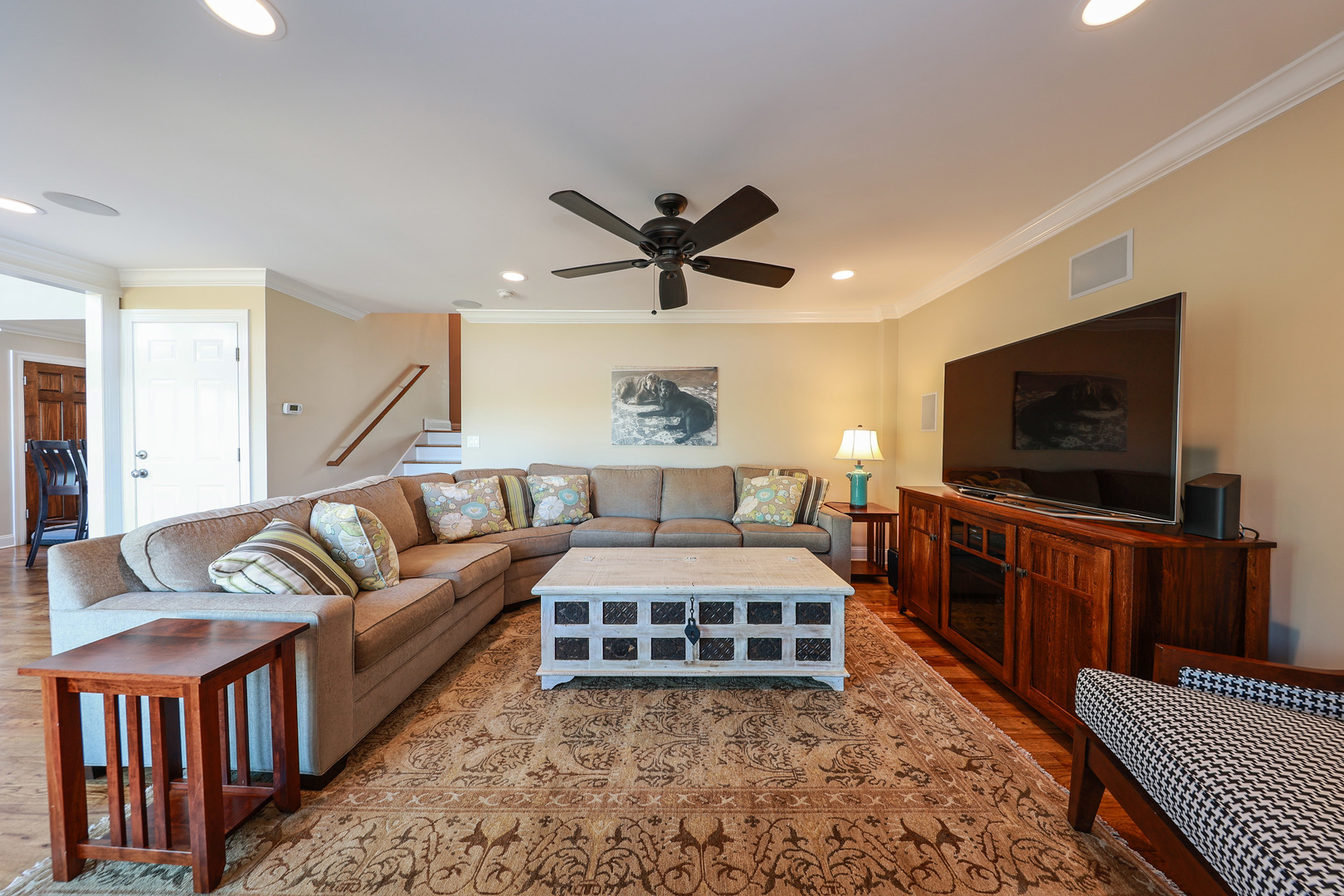 26000 Cottage Road Wilmington, IL 60481 - Photo 13 of 31 a living room with furniture a rug and a flat screen tv