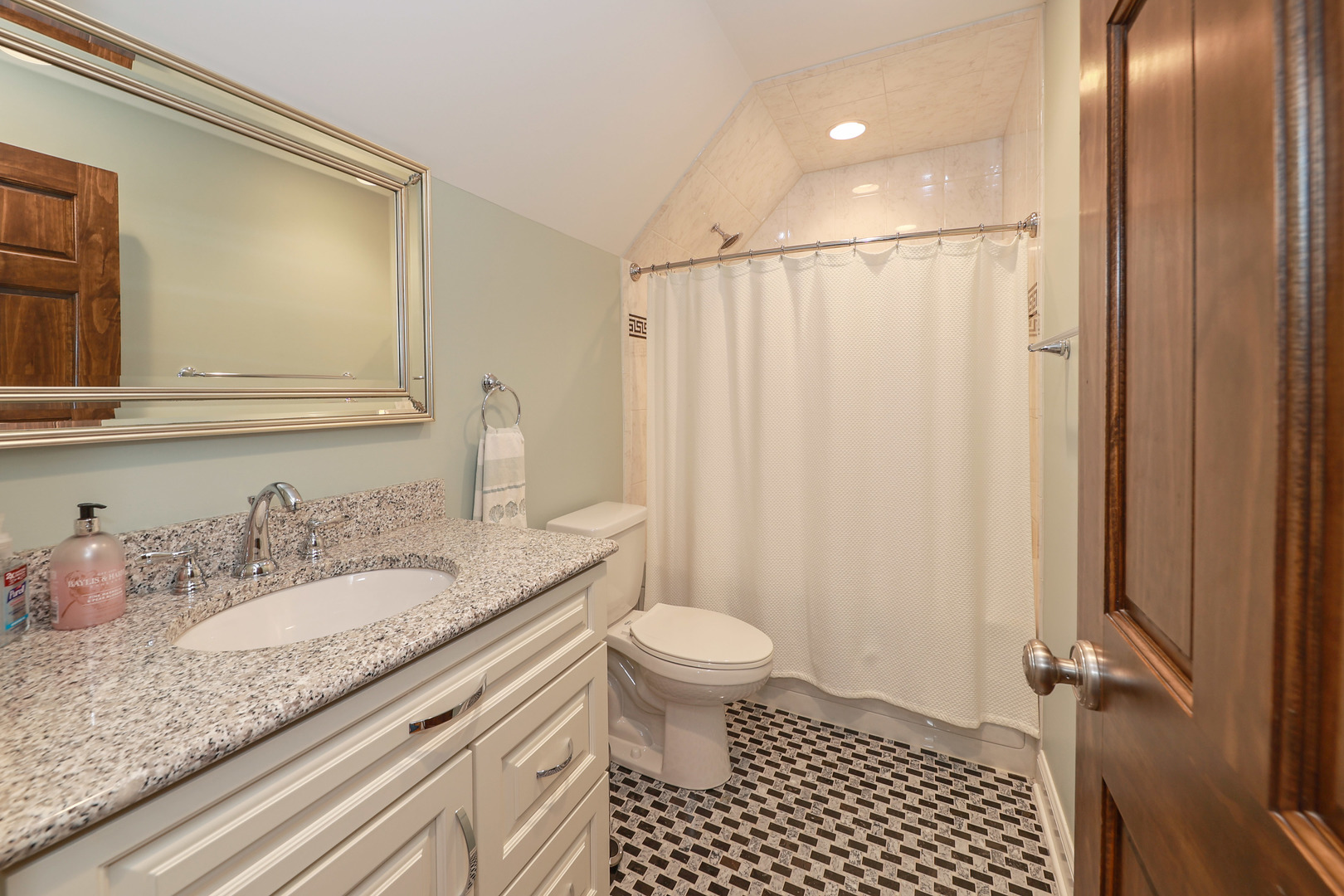 26000 Cottage Road Wilmington, IL 60481 - Photo 22 of 31 a bathroom with a granite countertop sink a toilet a mirror and shower