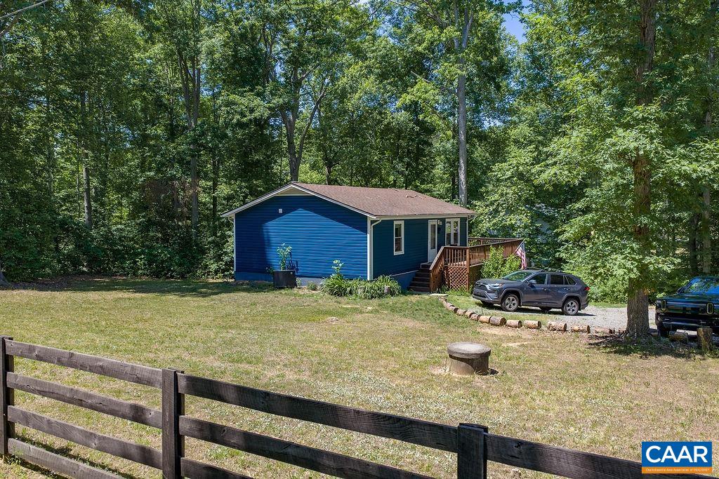 6920 Albevanna Spring Road Scottsville, VA 24590 - Photo 18 of 47 a view of a house with backyard swimming pool and sitting area