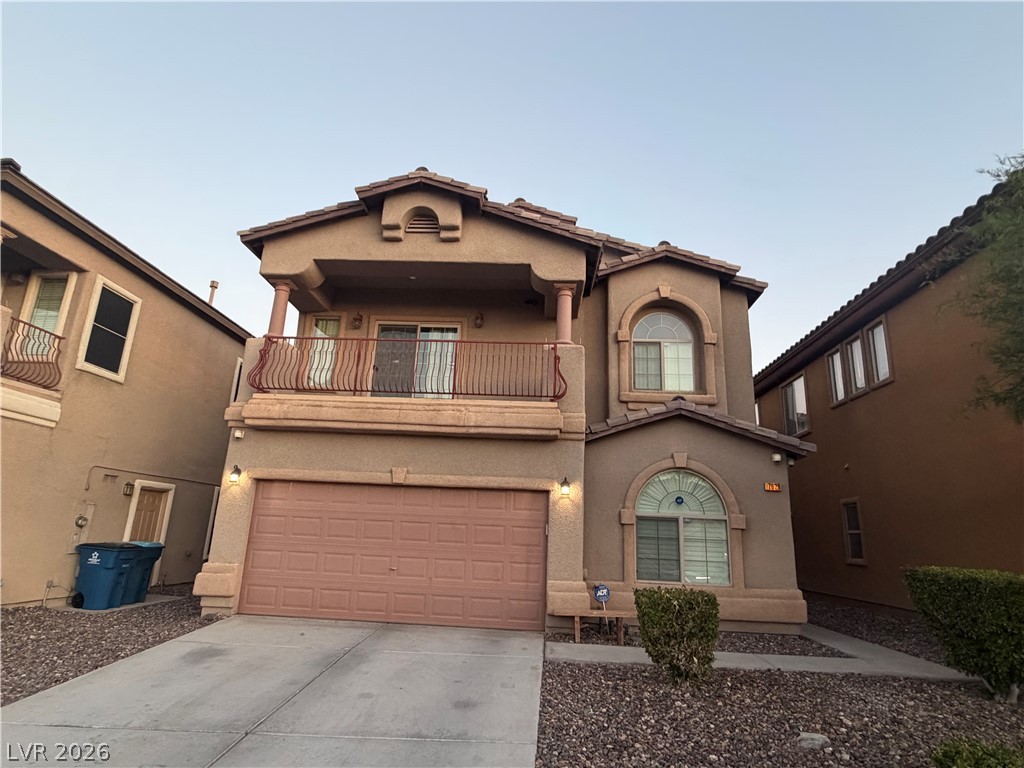 7629 Rory Court Las Vegas, NV 89129 - Photo 1 of 25 A classic stucco home with an inviting front balcony and a two-car garage awaits.