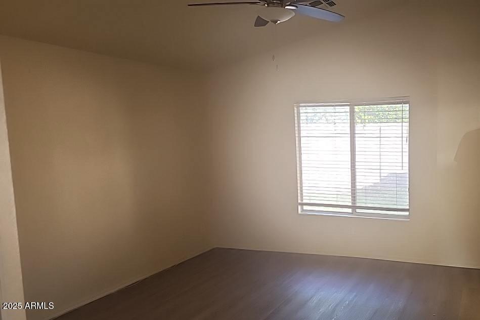 914 East Monterey Street Chandler, AZ 85225 - Photo 9 of 16 an empty room with wooden floor and windows