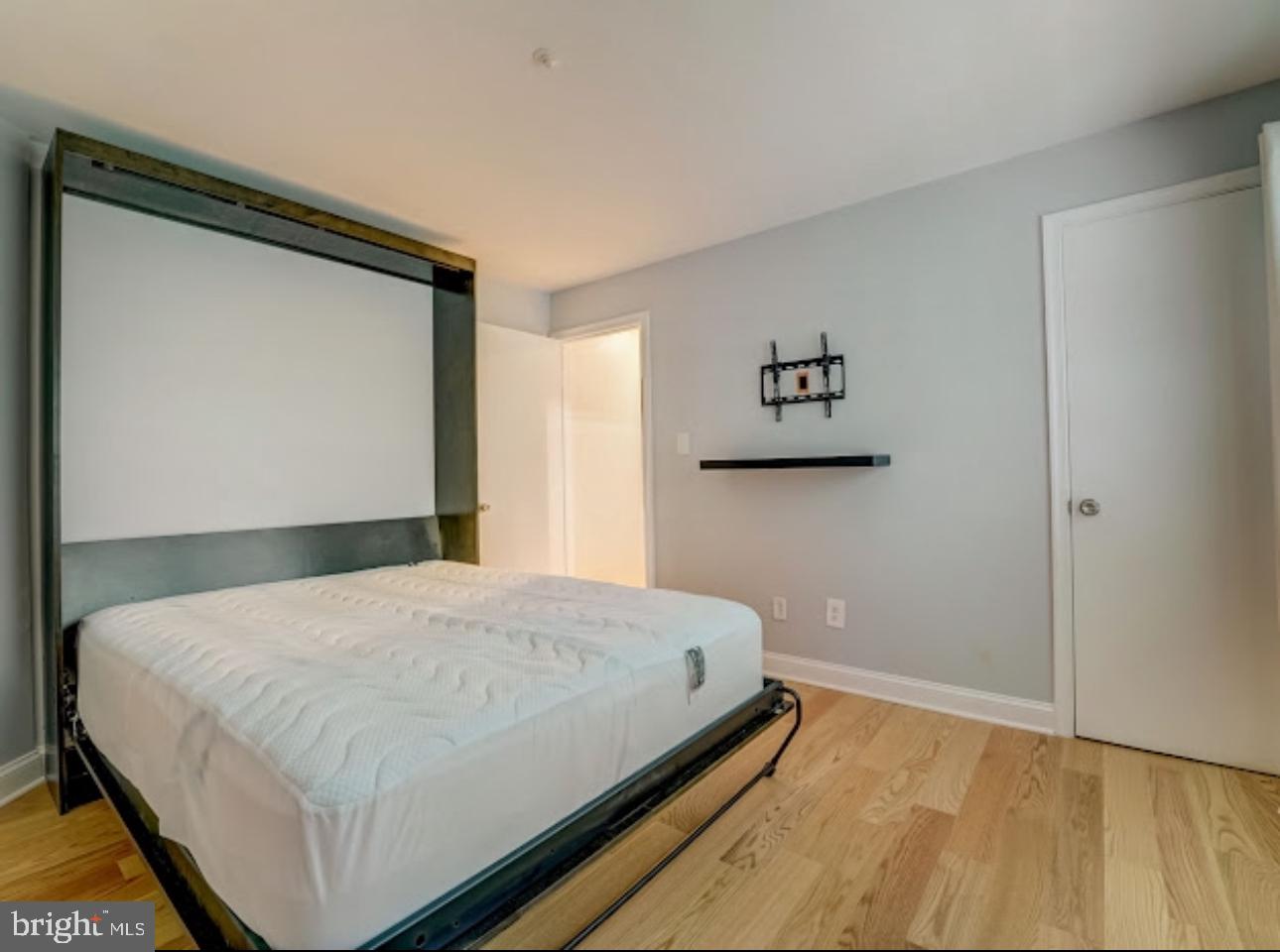 3313 Sir Thomas Drive Silver Spring, MD 20904 - Photo 11 of 15 a bedroom with a bed and a wall painting