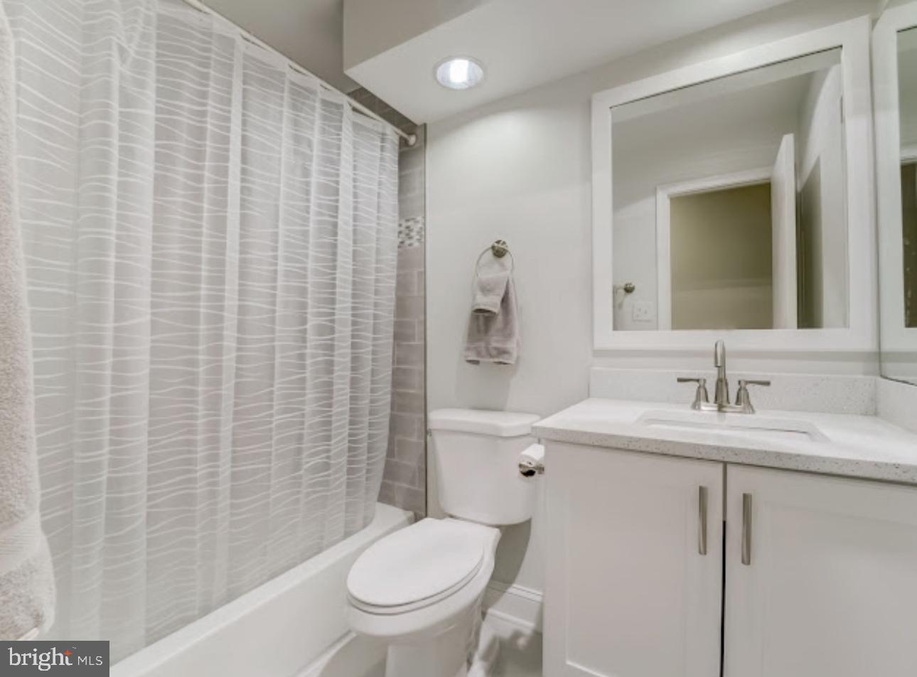3313 Sir Thomas Drive Silver Spring, MD 20904 - Photo 13 of 15 a bathroom with a sink a toilet and shower