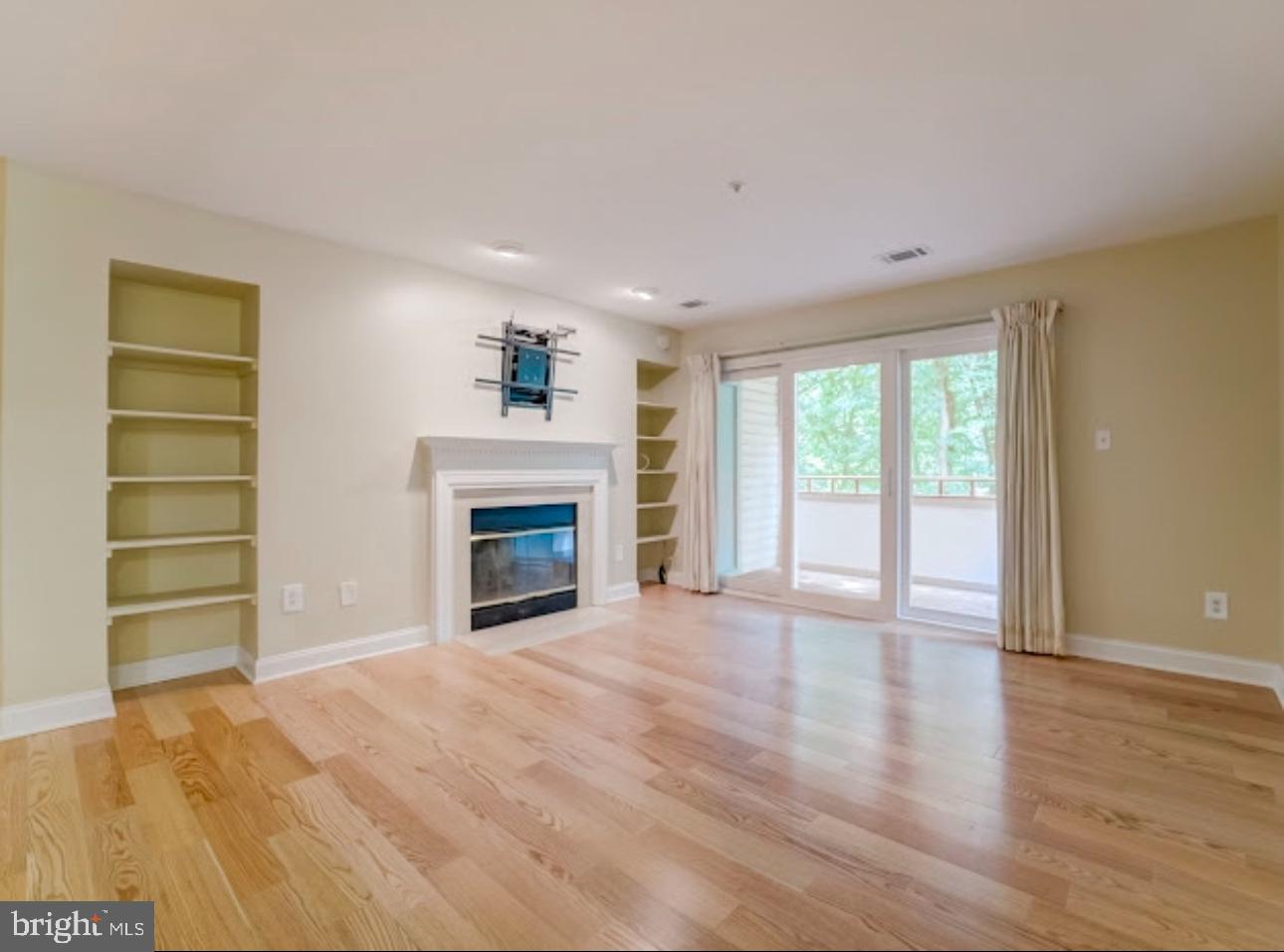3313 Sir Thomas Drive Silver Spring, MD 20904 - Photo 4 of 15 a view of an empty room with a window and fireplace