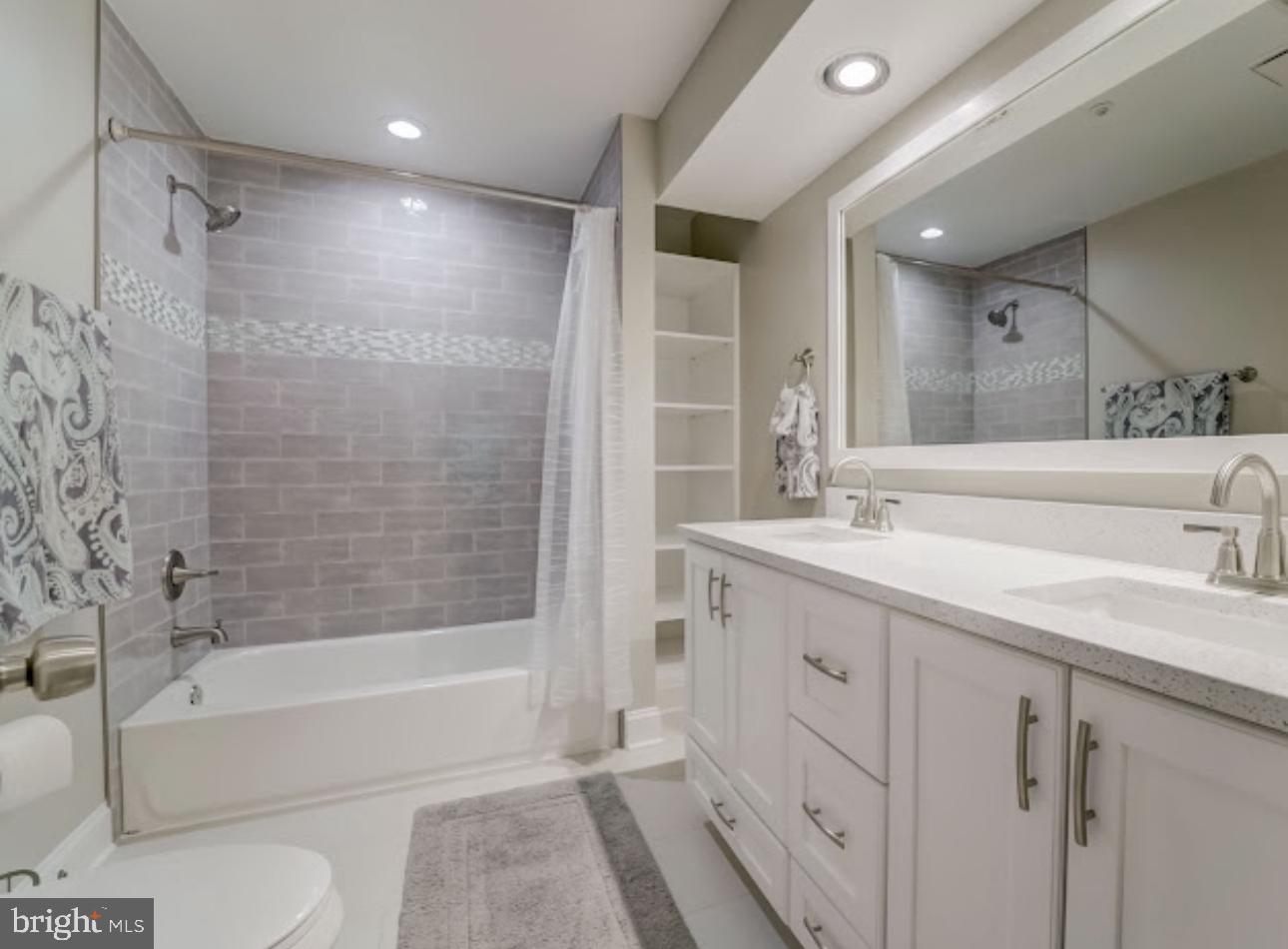 3313 Sir Thomas Drive Silver Spring, MD 20904 - Photo 9 of 15 a bathroom with a tub sink toilet and a mirror