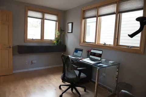 a workspace with furniture and windows