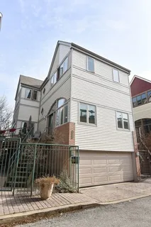 a front view of a house with a fence
