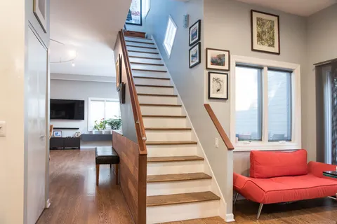 a view of livingroom with furniture and a floor to ceiling window